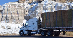 Cypress Truck Lines flatbed truck hauling construction materials