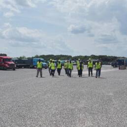 Cypress CDL School trainees walking through training yard during CDL program