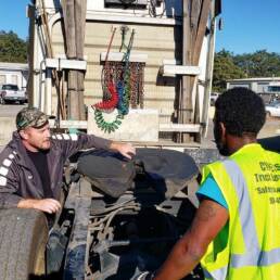 CDL trainees learning pre-trip inspection on a truck at Cypress CDL School
