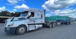 Cypress Truck Lines flatbed truck with loaded freight in yard