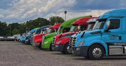 Cypress Truck Lines fleet of colorful trucks lined up at terminal yard