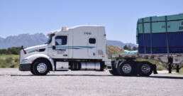 New CDL driver operating flatbed truck hauling secured materials with Cypress Truck Lines